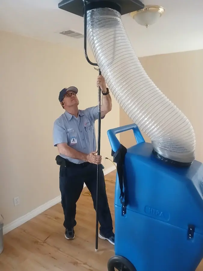Furnace Tune-Up technician using HEPA equipment in Everett